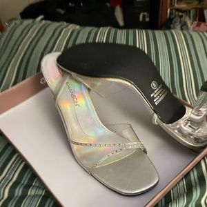 Sling back silver with transparent heels. Worn one time.  In time for Party!